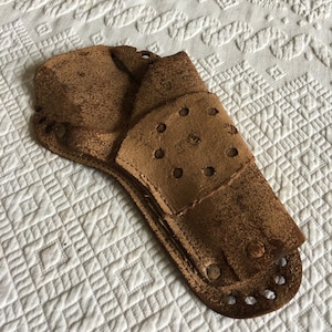 Antique Western  Cowboy Gear for Active Play. Leather Holster w/ Slits for Belt. Hole Designs. Add to a Western Collection. Cowboy Games.