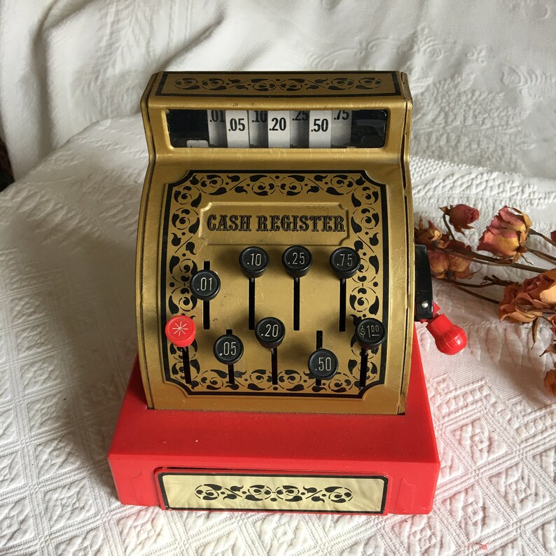 Gold With Black Print and Designs With Red Bottom Vintage Toy Cash Register Black and Red Plastic Handle Push Buttons to Raise Numbers.