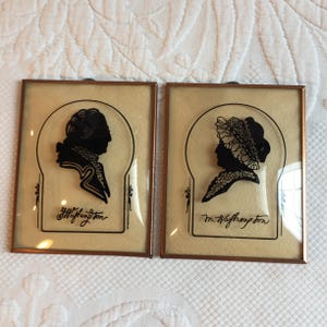 Vintage Silhouette Set on Convex Glass of George and Martha Washington. Framed in Copper with Cream Leather Look Textured Background.