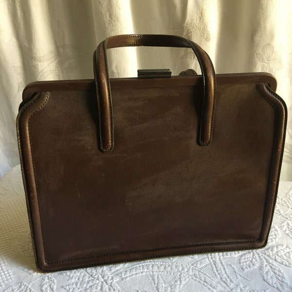 Vintage P.G.C. Briefcase Style Handbag. Brown Leather, Leather Ornament, 2 Side Handles, Suede Leather Interior w/ Pockets One Side Moire.