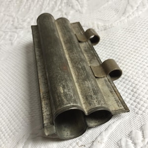 Antique Tin Mold for Club Shaped Tube. Mold Dough Then Slice. Two Clips to Hold Together Mold, Then Release for Cleaning.
