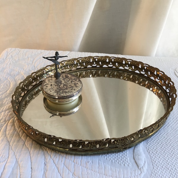 Vintage Gold Oval Mirror Tray with Openwork Flowers and Leaves Designs. Black Flocked Backing with 4 Rubber Feet.