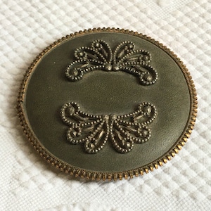 Vintage Maracas Leather/Vinyl w/ Steel Cut Curly Cue Floral Decorations on One Side, Brass Zipper Type Edge Around Rim. Unique Instrument.