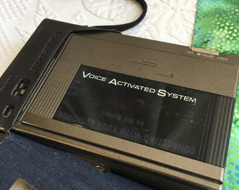 Vintage Panasonic Voice Activated System Recorder with Carrying Strap in Simulated Leather Protective Pouch.
