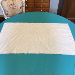 Vintage Linen Table Runner With Tone on Tone Embroidered Teapot and Teacup and Saucer at one Side. Light Blue Crochet Edging.