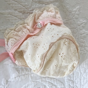 Vintage Lined Baby Bonnet. White Ridged Cotton Eyelet Fabric With Light Pink Cording, Front Trim and Satin Ties. Ruffled Front With Lace.
