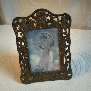 Vintage Art Nouveau Cupids Frame with Openwork in Bronze Look Finish. Tabletop Stand on Back. Insert a 3 1/4&quot; X 4 3/4&quot; Picture.
