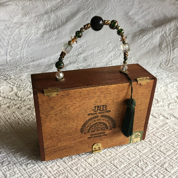 Vintage Cigar Box Purse. Hinges, Latch, Gold Ball Feet and Beaded Handle w/ Green Tassel. Beveled Mirror Inside Lid and Velvet Animal Print.