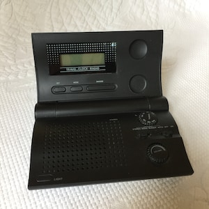 Vintage Travel Clock Radio. Folding Clock to Store or Travel. Earphone Outlet, Battery Operated.