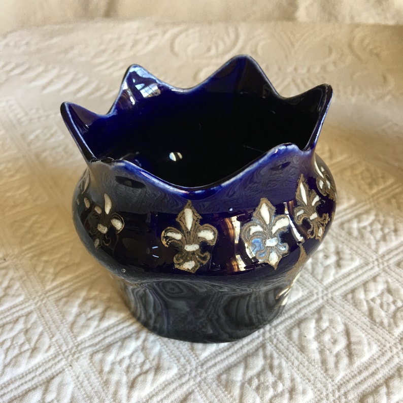 Probably Italian. Vintage Porcelain Blue Vase With Gold and Dimensional White Fleur de Lis Designs