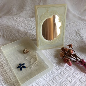 Vintage Clear Lucite Dresser Box. Embossed Framed Mirror Lid w/ Tabletop Stand. Fits on Jewelry Box as Lid. Set Up Lid to Put on Earrings.