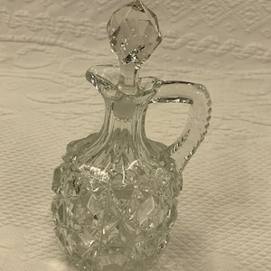 Vintage Oil Cruet. Glass Stopper and Ridges Down Back of Handle. Star Designs on Cruet. Use for Oil, Vinegar or Bath Oil. Charming Cruet.
