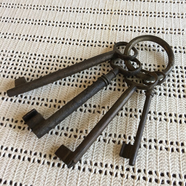 Cast Iron Large Keys on a Ring. Four Large Skeleton Keys Set. Great for Decorating Display. Look Old.