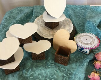 Craft Display Platforms. White Painted Wood Heart Shape Top With Plastic Basket Weave Square Bottom. Craft Display Platform.