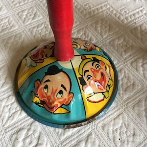 Vintage Noise Maker Bell Type Clown Noise Maker. Red Wooden Handle and Tin With Metal Clapper. 4 Pictured Clowns. Collectible Noise Maker.