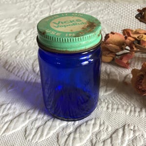 Vintage Cobalt Blue Vicks VapoRub Jar with Green and White Metal Screw On Lid. Add to a Vintage Bathroom Display or Bottle Collection.