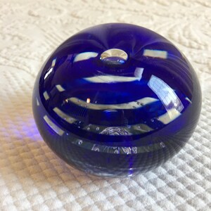 Vintage Paperweight. Spiraling Royal Blue Stripes and Small Bubbles Near Bottom and Large at Top. Blue and Clear Round Paperweight.