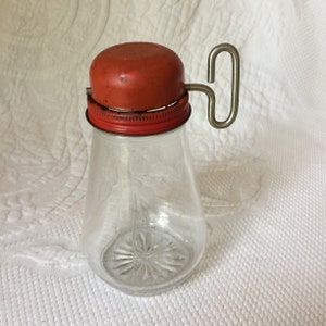 Vintage Nut Grinder with Attached Jar. Fill Jar with Nuts, Turn Over and Turn Key Handle to Grind. Round Domed Top.