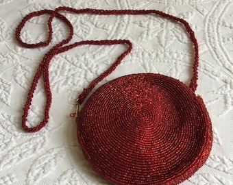 Vintage Neiman Marcus Beaded Red Evening Purse. Round with Beads in Circles and Beaded Shoulder Strap. Attached Fabric Framed Backed Mirror.