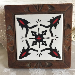 Vintage Tile Trivet Made in Mexico. Carved Wood Frame Around White Black and Red Tile Making a Decorative Trivet for Counter or Table.