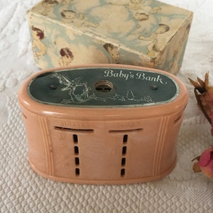 Vintage Celluloid and Metal Child&#39;s Bank. Stork Design with Baby&#39;s Bank on Top. Designated Coin Stacking and Counting Slots on Sides.