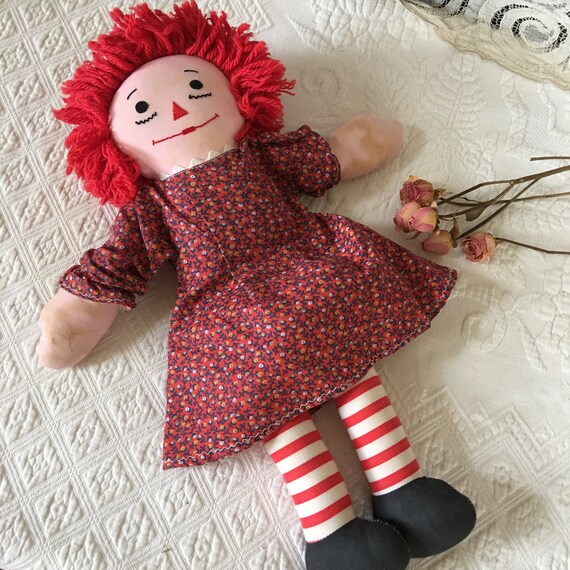 black raggedy ann doll with red hair