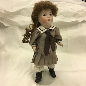Vintage 1983 Lawtons All Porcelain 13 1/2&quot; Doll, Brown Glass Eyes, Long and Short Curls. Drop Waist Pleated Sailor Dress. Shows Teeth. Hat.