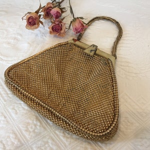 Vintage Gold Mesh Whiting and Davis Evening Bag. Beautiful Gold Lining with Pocket. Metal Mesh Cording on Both Sides of Purse and Handle.