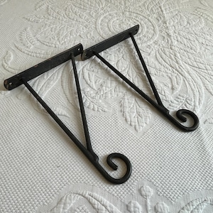 Vintage Wrought Iron Coated Wall Bracket Planter Hanger. Listing for One Wall Mounted Plant Hanger with Curly Cue End.