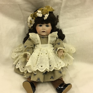 Vintage 1981 Porcelain 13&quot; Doll with Cotton Dress, Dark Brown Hair, Blue Glass Eyes, Parted Lips, Teeth Showing. So Charming.