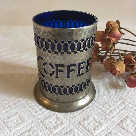 Vintage Coffee Container. Hammered Silver Plate Openwork Design With Lid. Cobalt Blue Hard Plastic Liner and Spoon Holder. Missing Spoon.