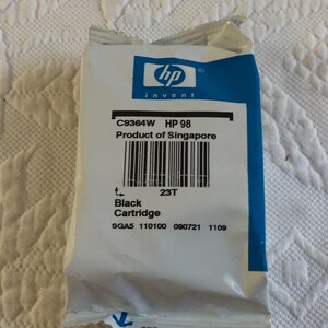 May include: A white and blue HP 98 black ink cartridge in its original sealed packaging. The label displays the text C9364W, HP 98, Product of Singapore, Black Cartridge, and a barcode. Additional printed codes include SGA5 110100 090721 1109.