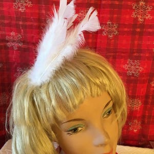 Fascinator Hair Comb With White Feathers. White Feathers Attached to a Clear Comb.