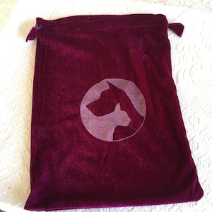 Velvet Drawstring Bag in Purple with Cat and Dog Circular Design on the Front. Ribbon Drawstring. Unlined.