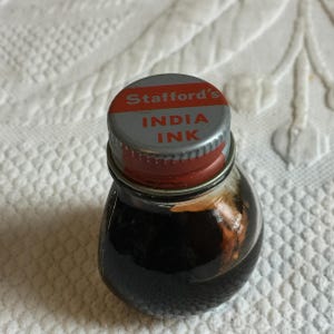 Vintage Stafford's India Ink Small Bottle. Separated Liquid Inside. Add to an Ink Bottle Display. Includes the Clear Bottle in the pictures.