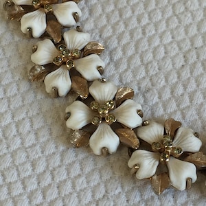 Vintage Dogwood Link Bracelet with 5 Rhinestones in Center of the 10 Flowers. Security Chain and 4 Rhinestones on Latch.