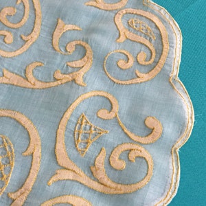 Victorian Shadow Embroidery Stitched Doily. Sheer Cotton and Gold Embroidery Floss Making Up a Scalloped Swirly Designed Shadow Stitchery.