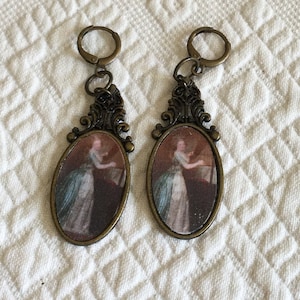 Hand Made Faux Oil Painting Ladies in Oval Settings in Antiqued Gold Finish With Princess Feather Design. Great for Costuming.