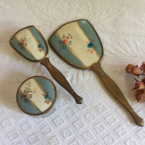 Vintage 1950s Dresser Set of Hand Mirror, Brush and Dresser Jar. Beveled Glass, Blue White Red Gold Flower Decorations on Plastic Backing.