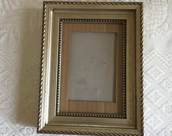 Silvery Gold Finish Picture Frame with Hobnail Design Around Picture and Twist Design on Outer Edge. Tabletop Stand on Back.