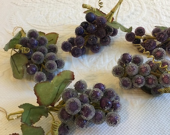 Vintage bluish purple glass‑beaded grapes with a frosted finish. Ideal for decorative accents. Price is for a single cluster of grapes.