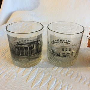 Vintage Pair 1973 Manassas Centennial Glasses. Great for Barware. Print in Black on Clear Glass. Textured Glass on Bottom.