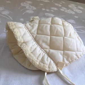 Vintage Quilted and Lined Baby Bonnet. Front Ruffle with Lace Edge, Satin Ribbons and Top Lace Ornament.