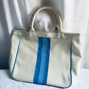 Vintage Estee Lauder Blue and White Textured Vinyl Handbag. Blue Cording and Front Stripes on White. Blue Lining.