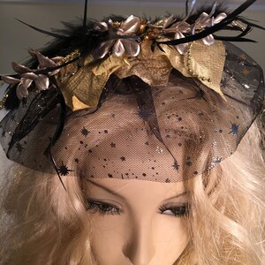 Fascinator With Sparkly Leaves, Black Soft and Spiky Feathers, and Black Veil With Stars. Hair Clip on the Back. Gold Bead Accents.