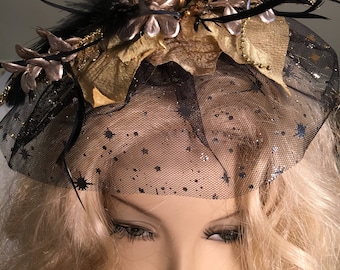 Fascinator With Sparkly Leaves, Black Soft and Spiky Feathers, and Black Veil With Stars. Hair Clip on the Back. Gold Bead Accents.