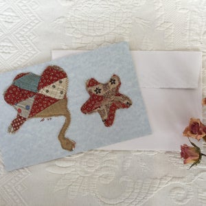 Blank carte de Note pour le Quilt, Quilt pièces cow-girl chapeau Antique, étoile à l’aide de Antique Quilt pièces cousu sur papier cartonné blanc. Une carte enveloppe.