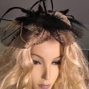 Fascinator With Sparkly Leaves, Black Soft and Spiky Feathers, and Black Veil With Stars. Hair Clip on the Back. Gold Bead Accents.