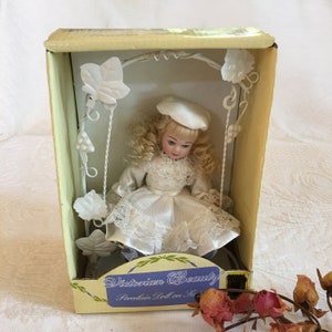 Vintage Porcelain Doll on Swing. Victorian Beauty Doll. Bisque Porcelain Doll with Detailed Accessories. Blonde Hair and Blue Eyes.