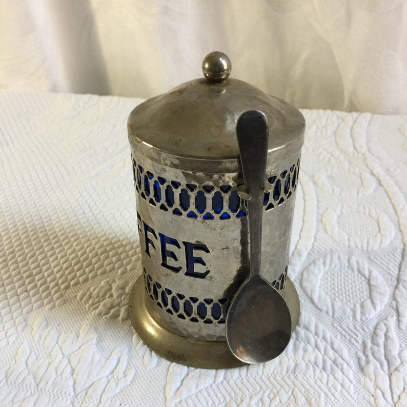Vintage Coffee Container. Hammered Silver Plate Openwork Design w/ Lid and Spoon. Cobalt Blue Hard Plastic Liner and Spoon Holder. image 2